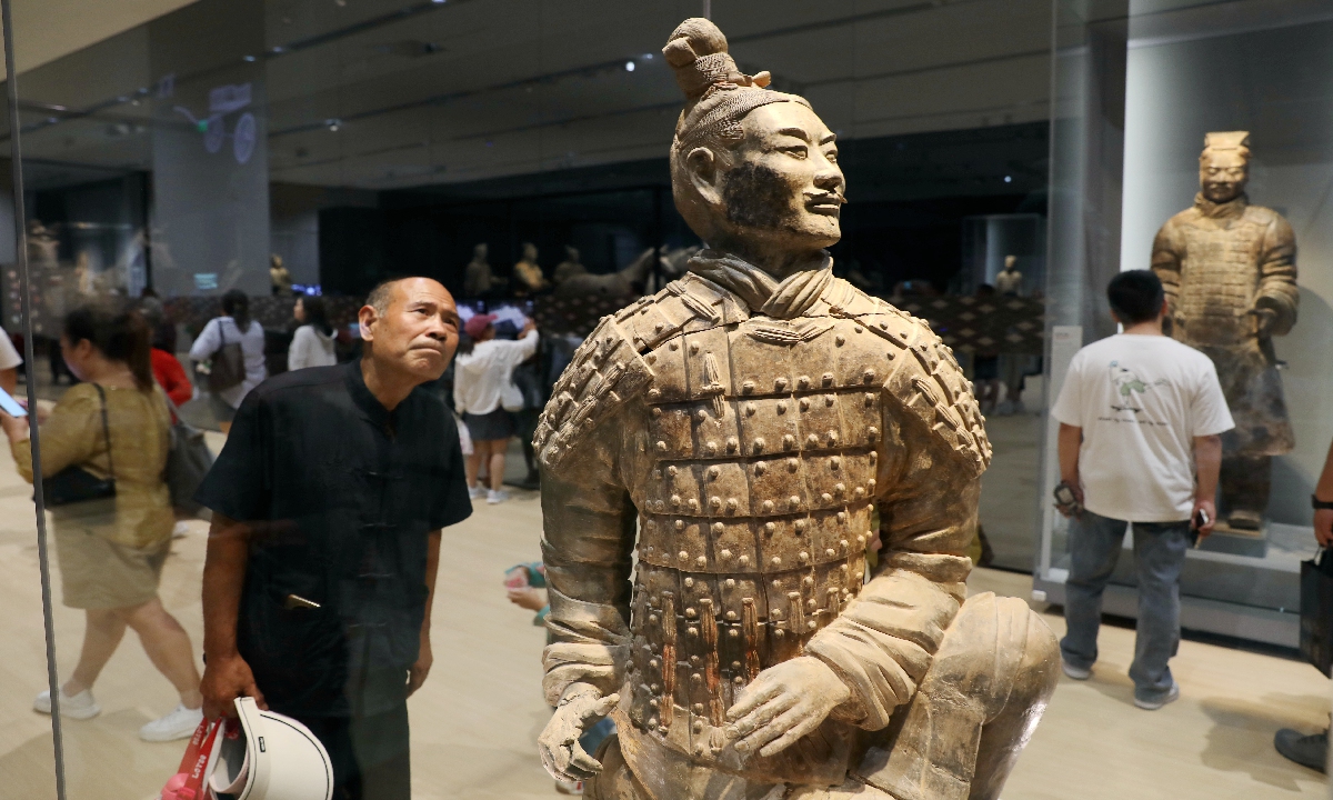 A man looks at a life-size Terracotta soldier at an exhibition at Emperor Qinshihuang's Mausoleum Site Museum on September 8, 2024 in Xi'an, Shaanxi Province. This year marks the 50th anniversary of the discovery of the Terracotta Warriors. Photo: cnsphoto