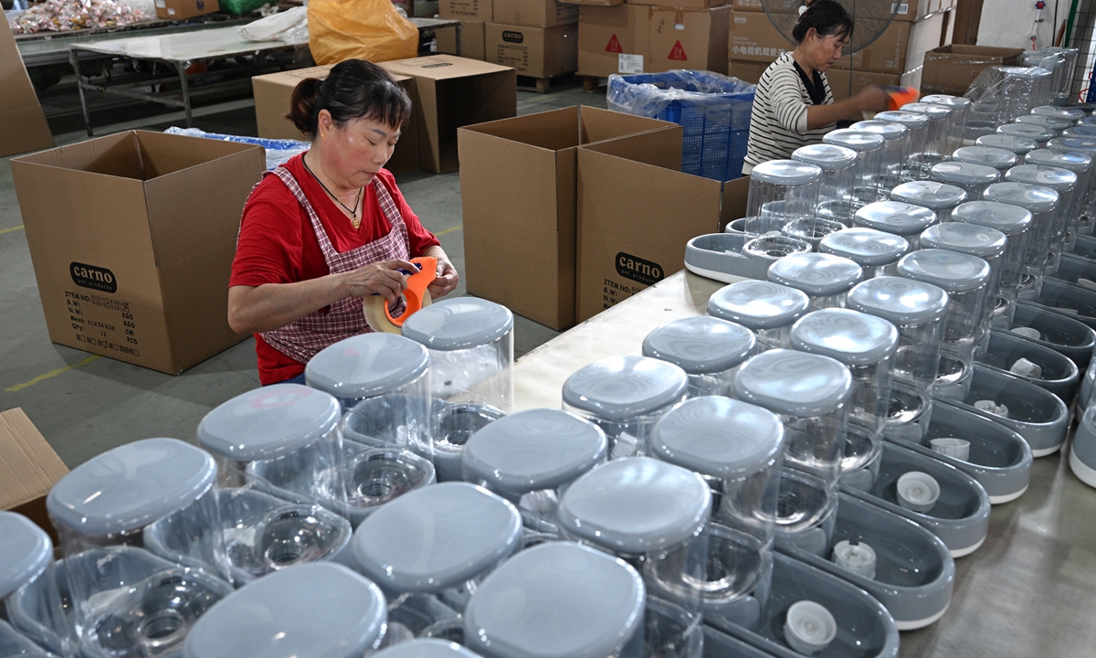 Workers assemble pet water dispensers at a factory in Suqian, East China's Jiangsu Province on September 10, 2024. In 2023, China's urban pet consumption market stood at 279.3 billion yuan ($39.23 billion), and it is expected to reach 361.3 billion yuan by 2026. With increasing demand and a growing industry scale, the country's