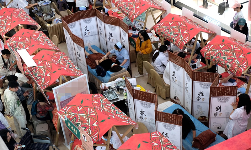People stroll through a traditional Chinese medicine bazaar and visit traditional Chinese medicine clinics in Shenyang, Northeast China's Liaoning Province, on September 17, 2024. Photo: VCG