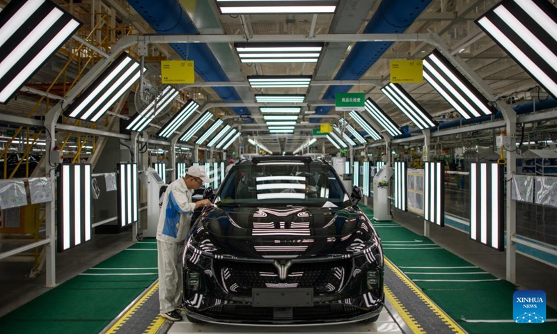 A worker checks the quality of a new vehicle at an assembly line of Dongfeng Motor Corporation in Wuhan, central China's Hubei Province, Sept. 6, 2024. (Photo: Xinhua)