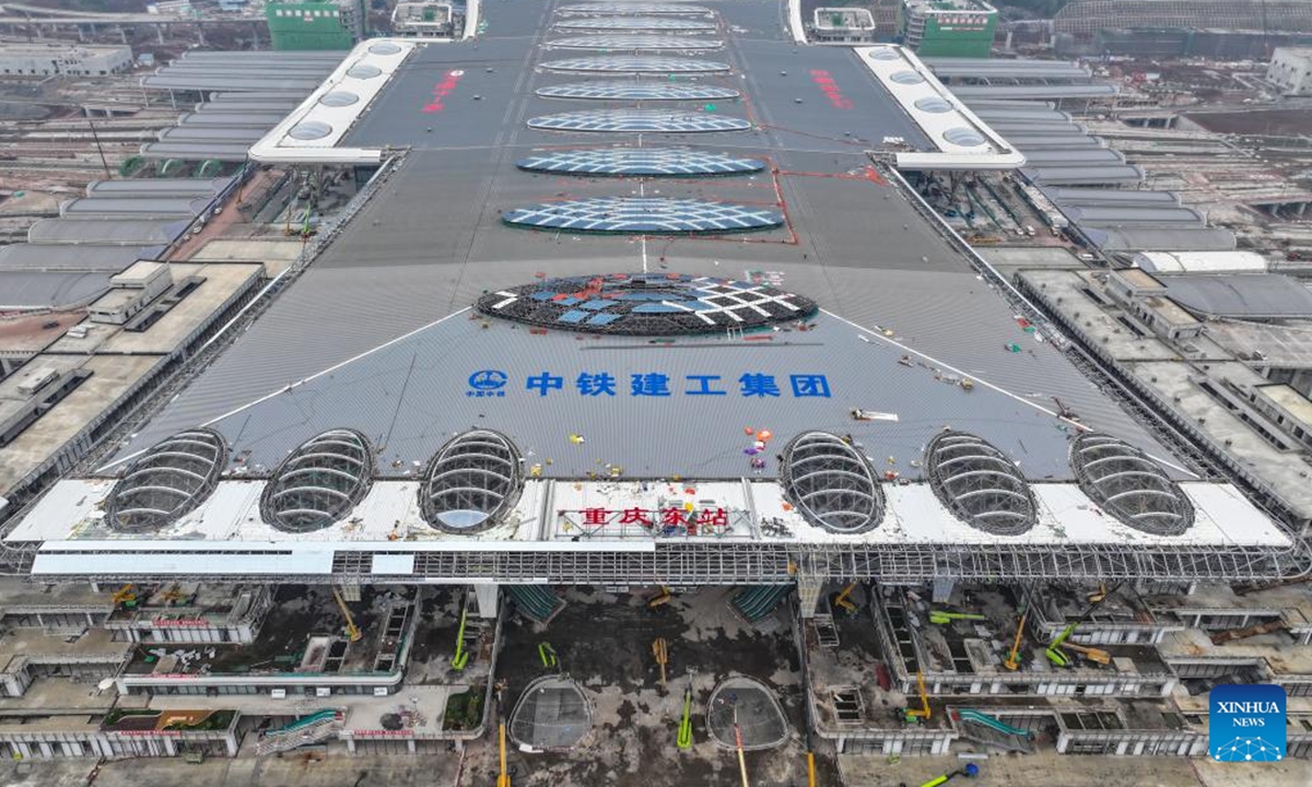 A drone photo taken on Oct. 6, 2024 shows the construction site of Chongqing East Railway Station and affiliated comprehensive transportation hub in southwest China's Chongqing. Workers are busy constructing the Chongqing East Railway Station during the National Day holiday as the station is expected to start operation in 2025. (Photo: Xinhua)