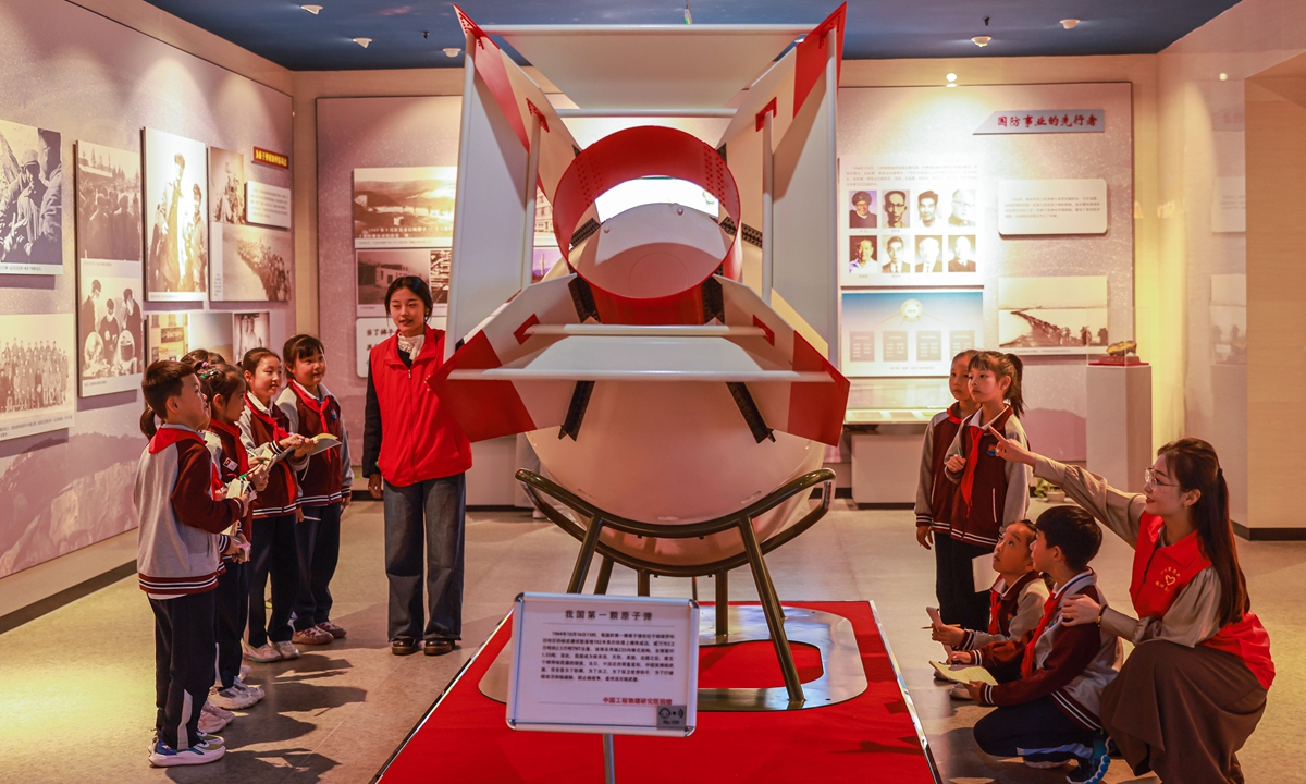 Teachers and students visit a miniature model of China's first atomic bomb at the Guo Yonghuai Memorial Hall in Rongcheng, Shandong Province, on October 16, 2024. A pioneer of modern Chinese mechanics, Guo made significant contributions to mechanics, applied mathematics, and aeronautics. Photo: IC