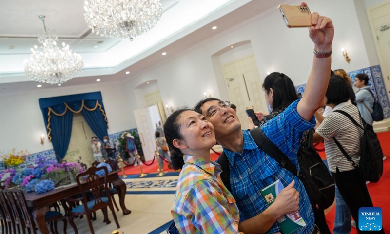 People take a selfie while visiting the government headquarters of the Macao Special Administrative Region on the open day in Macao, south China, Oct. 27, 2024. (Photo: Xinhua)