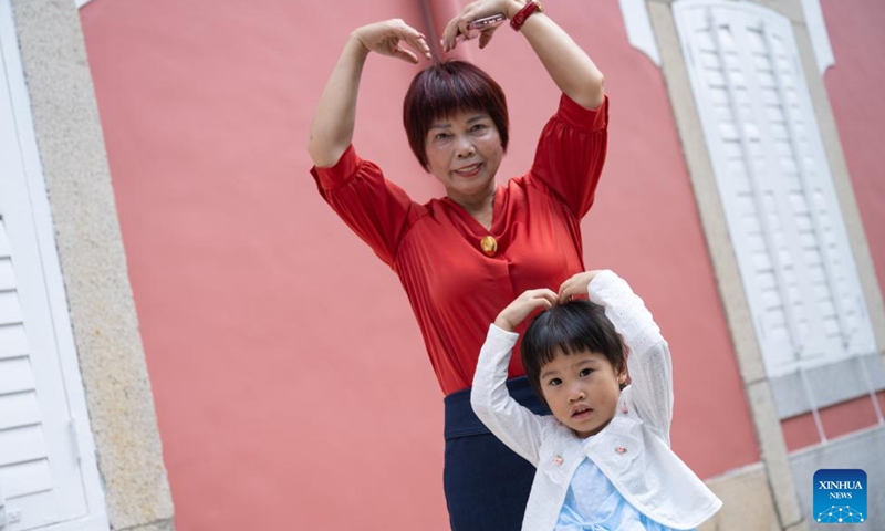 People pose for a photo while visiting the government headquarters of the Macao Special Administrative Region on the open day in Macao, south China, Oct. 27, 2024. (Photo: Xinhua)