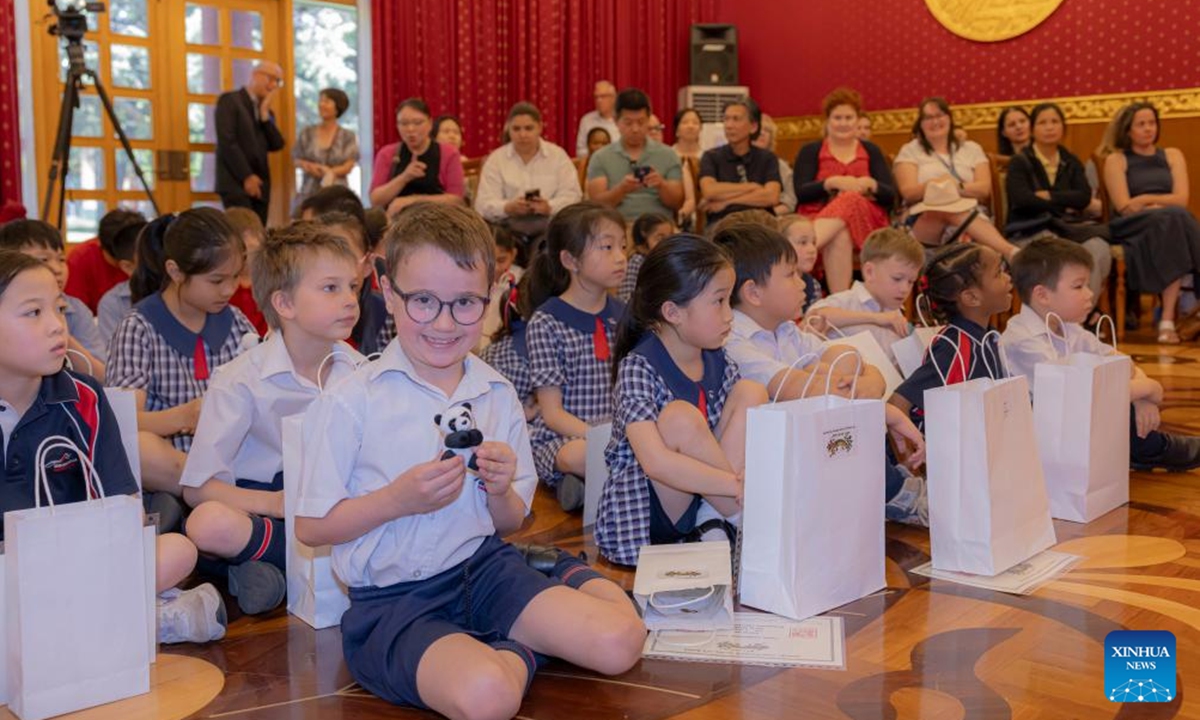 A student shows his panda doll award during the Panda Competition at the Chinese Embassy in Australia, in Canberra, Australia on Nov. 6, 2024. Australian children in Canberra were awarded on Wednesday for their paintings, sculptures, poems, creative collage and constructions surrounding the subject of the Chinese and the Australian gold rushes. (Photo: Xinhua)