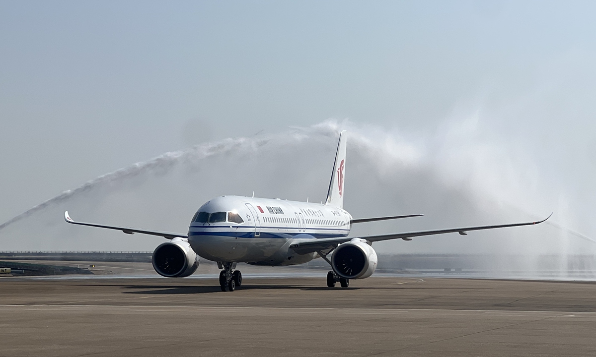China's domestically developed C919 passenger aircraft receives water salute at Macao International Airport on November 7, 2024. It is the first time that the C919 aircraft lands in Macao. Photo: VCG