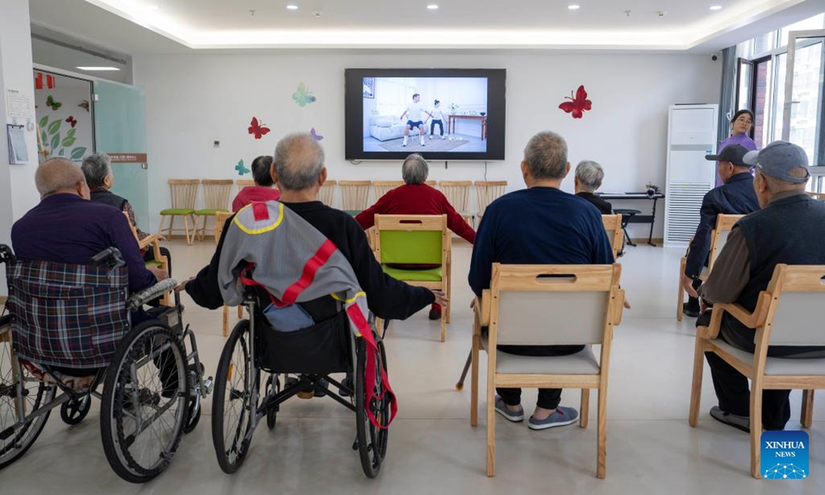 Senior residents do physical exercise at an elderly care center in Rizhao, east China's Shandong Province, Nov. 11, 2024.
The city of Rizhao has in recent years been committed to enhancing elderly care services that integrate medical, fitness, and daily care through at-home and community-based facilities. (Photo: Xinhua)
