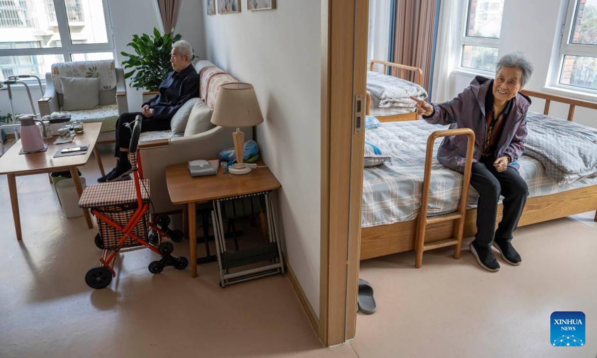 A senior couple takes a rest inside their suite at an elderly care center in Rizhao, east China's Shandong Province, Nov. 11, 2024.
The city of Rizhao has in recent years been committed to enhancing elderly care services that integrate medical, fitness, and daily care through at-home and community-based facilities. (Photo: Xinhua)