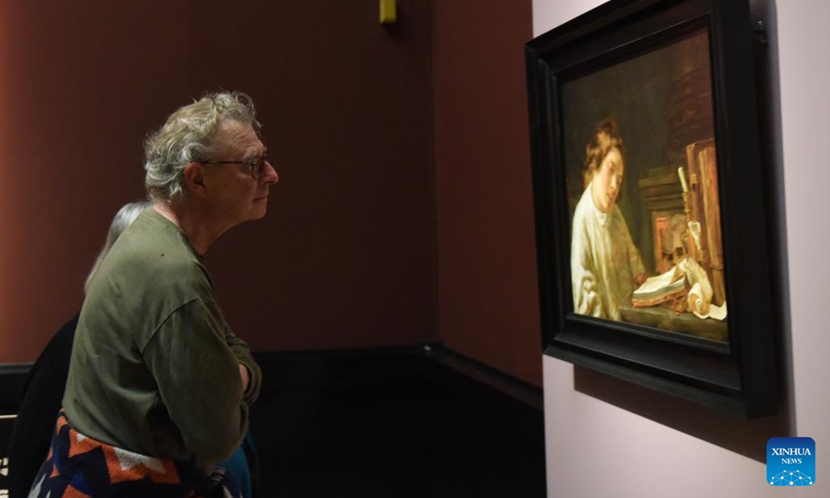 A visitor looks at a Hoogstraten's painting work at Art History Museum Vienna, Austria, Nov. 13, 2024. A special exhibition named Rembrandt-Hoogstraten: Colour and Illusion is held here from Oct. 8, 2024 to Jan. 12, 2025. (Photo: Xinhua)