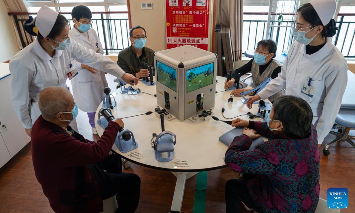 Senior residents undergo rehabilitation training at an elderly care center in Rizhao, east China's Shandong Province, Nov. 11, 2024.
The city of Rizhao has in recent years been committed to enhancing elderly care services that integrate medical, fitness, and daily care through at-home and community-based facilities. (Photo: Xinhua)