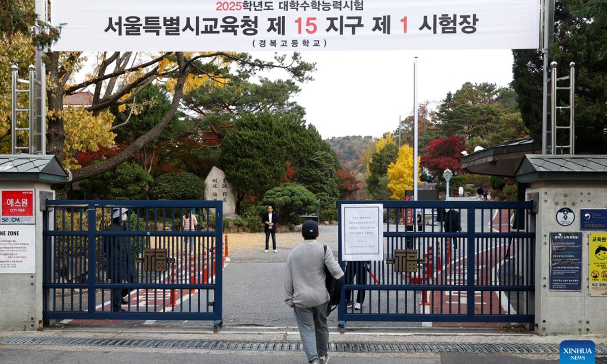 An examinee of the College Scholastic Ability Test (CSAT) enters the Gyeongbok High School in Seoul, South Korea, Nov. 14, 2024. South Korean students on Thursday took an annual college entrance exam, seen highly important in an education-obsessed society.
  (Photo: Xinhua)