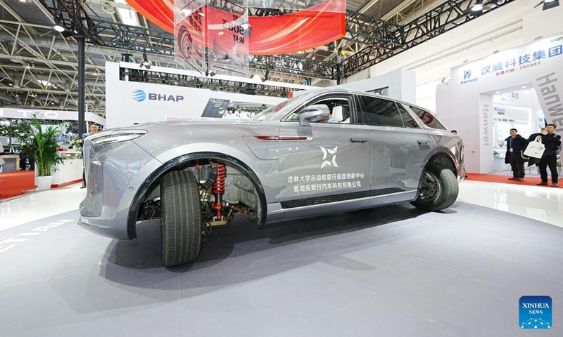 A visitor tries a car at the booth of China's Ketian New Material at the second China International Supply Chain Expo (CISCE) in Beijing, capital of China, Nov. 28, 2024.