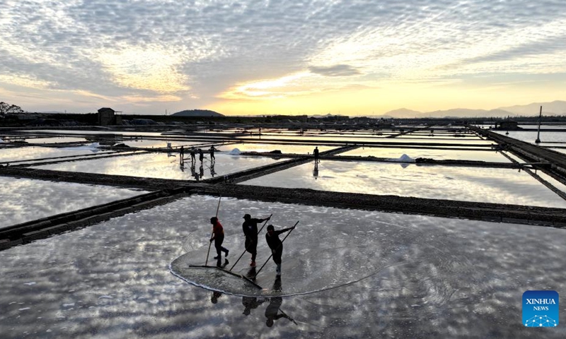 An aerial drone photo taken on Nov. 30, 2024 shows people working at a salt field in Quanzhou, southeast China's Fujian Province. Photo: Xinhua