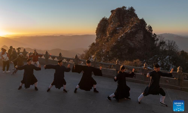 An aerial drone photo shows Taoist priests practicing martial arts at golden peak on the Wudang Mountain in Shiyan City in central China's Hubei Province, Nov. 29, 2024. Tai Chi, a centuries-old Chinese martial art focusing on both internal and external practices, involves a series of slow, gentle movements and physical postures, a meditative state of mind, and controlled breathing. Statistics show that over 100 million people across more than 150 countries and regions practice Tai Chi, with about 30,000 foreigners traveling to the Wudang Mountain annually to learn and experience it. Photo: Xinhua