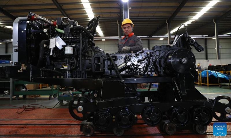 A worker assembles a tractor at a local company in Chenzhou, central China's Hunan Province, Nov. 29, 2024. In recent years, central China's Hunan Province has continuously utilized its manufacturing strengths to develop its agricultural machinery industrial chains, accelerating its transformation from traditional agriculture to modern agriculture. Photo: Xinhua