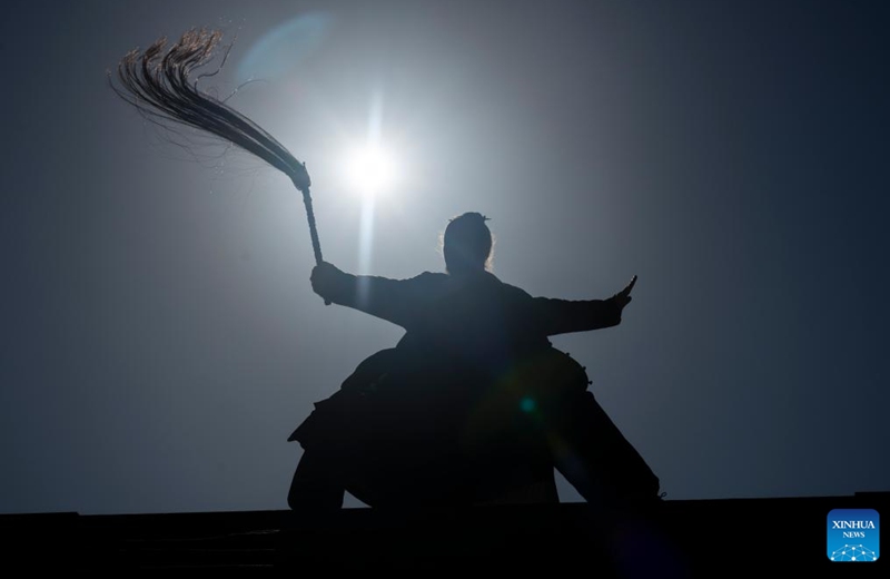 Jake Pinnick practices martial arts at Yuxu Gong Temple in Shiyan City in central China's Hubei Province, Nov. 29, 2024. An American who traveled to the Wudang Mountain to study martial arts in 2010, Jake Pinnick now serves as an instructor, imparting knowledge of Tai Chi and Chinese culture to a global audience. Tai Chi, a centuries-old Chinese martial art focusing on both internal and external practices, involves a series of slow, gentle movements and physical postures, a meditative state of mind, and controlled breathing. Statistics show that over 100 million people across more than 150 countries and regions practice Tai Chi, with about 30,000 foreigners traveling to the Wudang Mountain annually to learn and experience it. Photo: Xinhua
