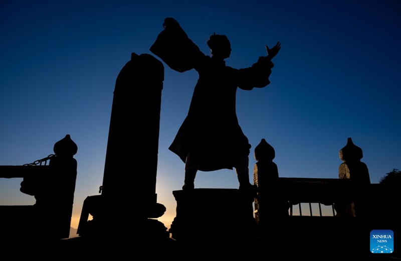 A Taoist priest practices martial arts at golden peak on the Wudang Mountain in Shiyan City in central China's Hubei Province, Nov. 29, 2024. Tai Chi, a centuries-old Chinese martial art focusing on both internal and external practices, involves a series of slow, gentle movements and physical postures, a meditative state of mind, and controlled breathing. Statistics show that over 100 million people across more than 150 countries and regions practice Tai Chi, with about 30,000 foreigners traveling to the Wudang Mountain annually to learn and experience it. Photo: Xinhua
