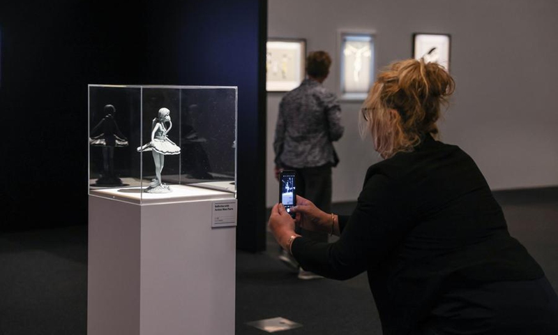 A spectator visits the exhibition The Art of Banksy in Wellington, New Zealand, Dec. 3, 2024. Photo: Xinhua