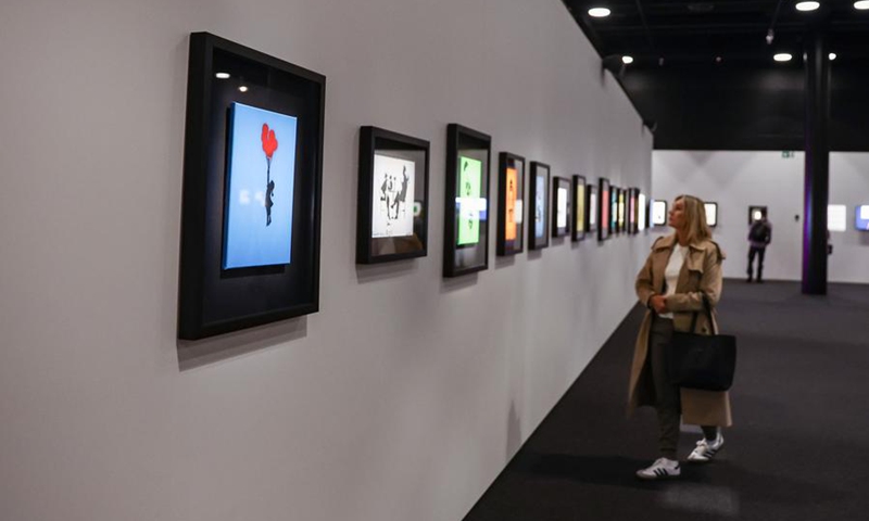 A spectator visits the exhibition The Art of Banksy in Wellington, New Zealand, Dec. 3, 2024. Photo: Xinhua