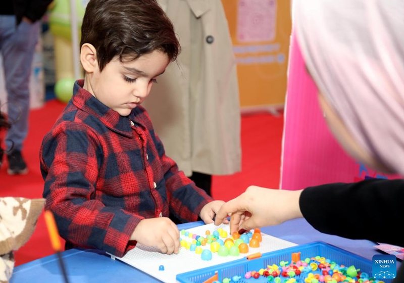 A child plays a game at the third edition of the International Festival for Iraqi Children in Baghdad, Iraq, on Dec. 3, 2024. Photo: Xinhua