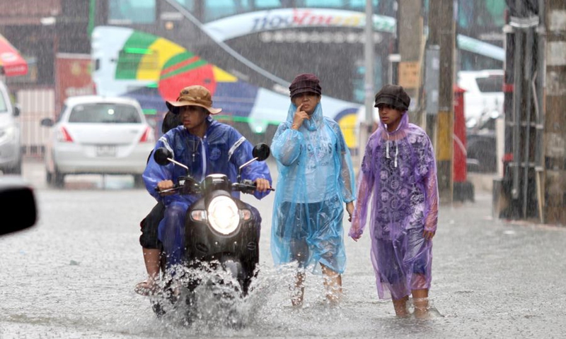 People walk in flood water in Yala Province, Thailand, Nov. 27, 2024. Photo: Xinhua