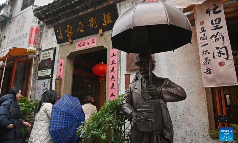 Tourists pay a visit to a homestay themed on photography at the Youbu ancient town of Lanxi City, east China's Zhejiang Province, Dec. 5, 2024. Youbu ancient town, with a history of more than 1,300 years, is well known for its morning tea and photography elements and attracts a large number of tourists. (Photo: Xinhua)