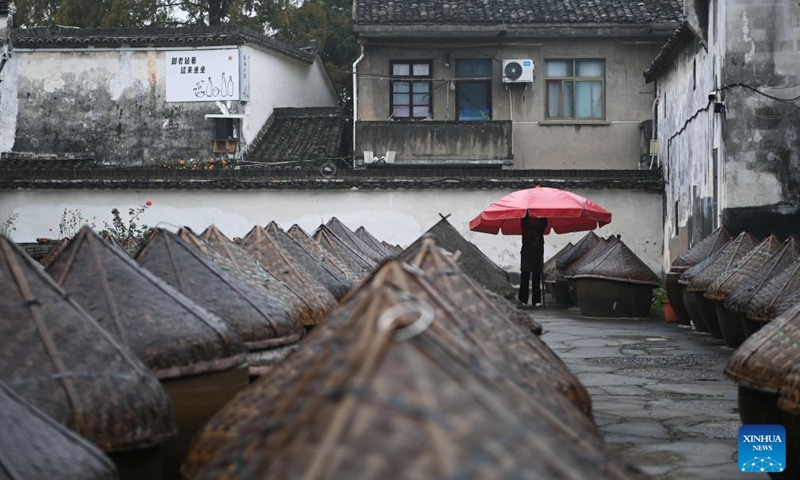 A villager works in a soybean paste workshop at the Youbu ancient town of Lanxi City, east China's Zhejiang Province, Dec. 5, 2024. Youbu ancient town, with a history of more than 1,300 years, is well known for its morning tea and photography elements and attracts a large number of tourists. Photo: Xinhua