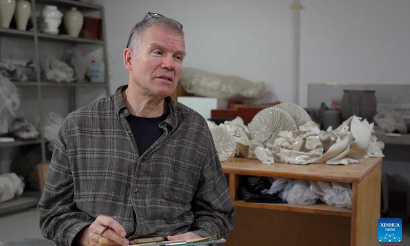 Marc Leuthold receives an interview with Xinhua at his studio in Quyang County, north China's Hebei Province, Nov. 20, 2024. (Photo: Xinhua)