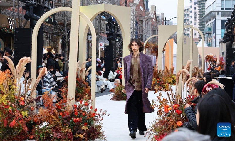 A model presents a creation during a fashion show held at Zhangyuan, or Zhang's Garden, in east China's Shanghai, Dec. 7, 2024. With the century-old Shikumen complex as the background and the Maoming North Road as the runway, a fashion show was held here on Saturday, bringing together the creations of many outstanding young designers in China. Photo: Xinhua