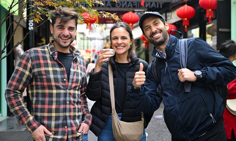 Tourists from Spain visit Tianzifang, an art area in east China's Shanghai, Dec. 3, 2024. Expanding visa-free policy is a milestone in China's journey toward greater openness and also shows its confidence on the global stage. So far, 38 countries enjoy unilateral visa-free access, and the maximum stay for visitors has been extended to 30 days as of Nov. 30. Photo: Xinhua