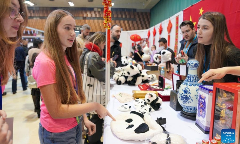 People select toy panda at the Chinese Embassy's booth during the Diplomatic Winter Bazaar held in Sarajevo, Bosnia and Herzegovina, Dec. 7, 2024. Photo: Xinhua
