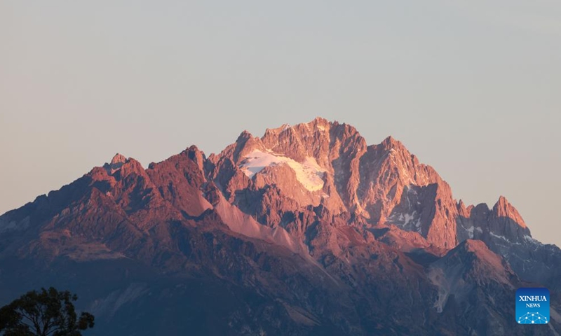 This photo taken on Dec. 9, 2024 shows sunlight shining on the Yulong Snow Mountain in Lijiang City, southwest China's Yunnan Province.  (Photo: Xinhua)