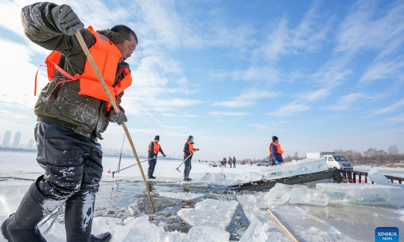 Workers collect ice from the Songhua River in Harbin, capital of northeast China's Heilongjiang Province, Dec. 9, 2024. (Photo: Xinhua)