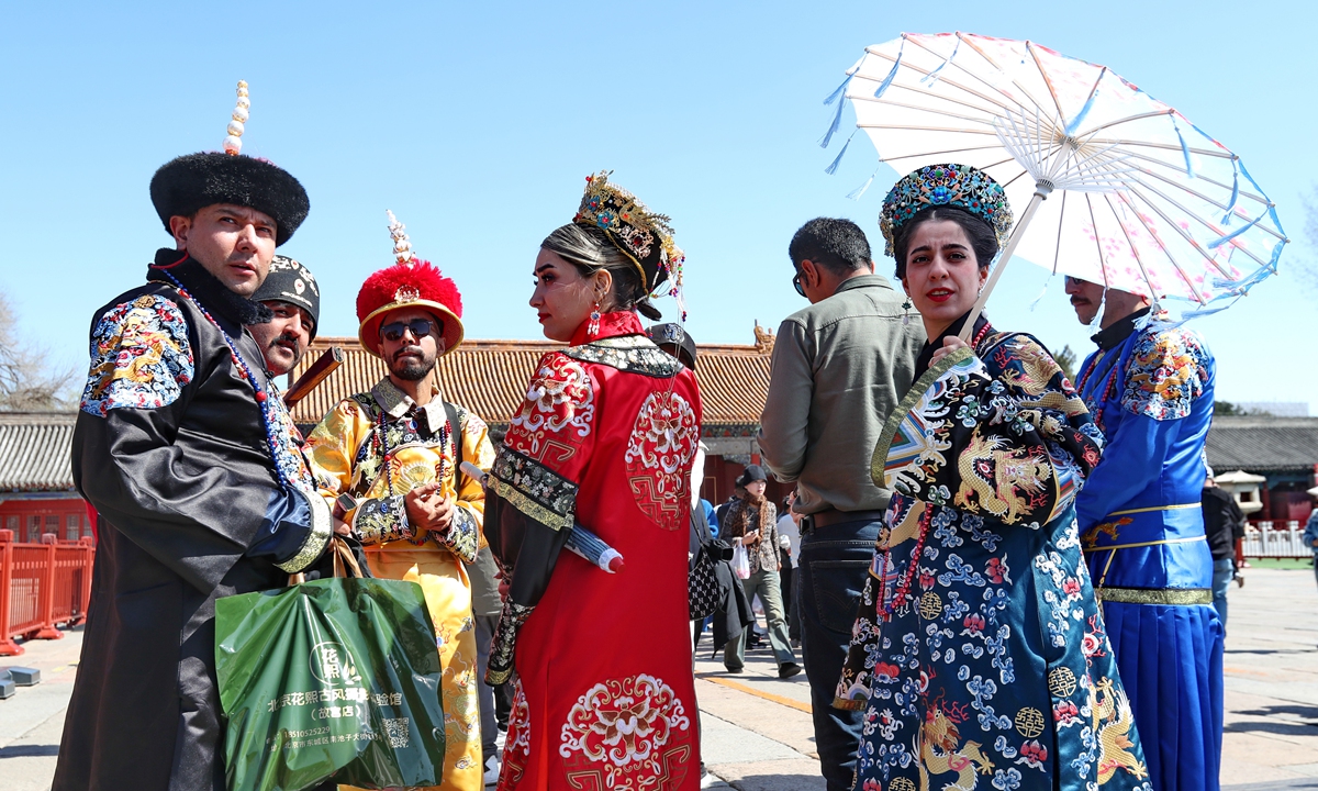 Foreign travelers in traditional clothing from the Qing Dynasty (1644-1911) visit the Palace Museum in Beijing on March 22, 2024. Photo: VCG