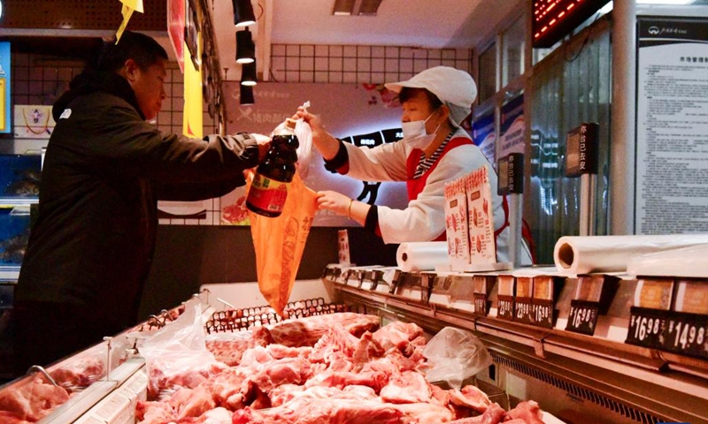 A customer purchases meat at a supermarket in Shijiazhuang, north China's Hebei Province, Dec. 9, 2024. China's consumer price index (CPI), a main gauge of inflation, was up 0.2 percent year on year in November, the National Bureau of Statistics said Monday.  (Photo: Xinhua)
