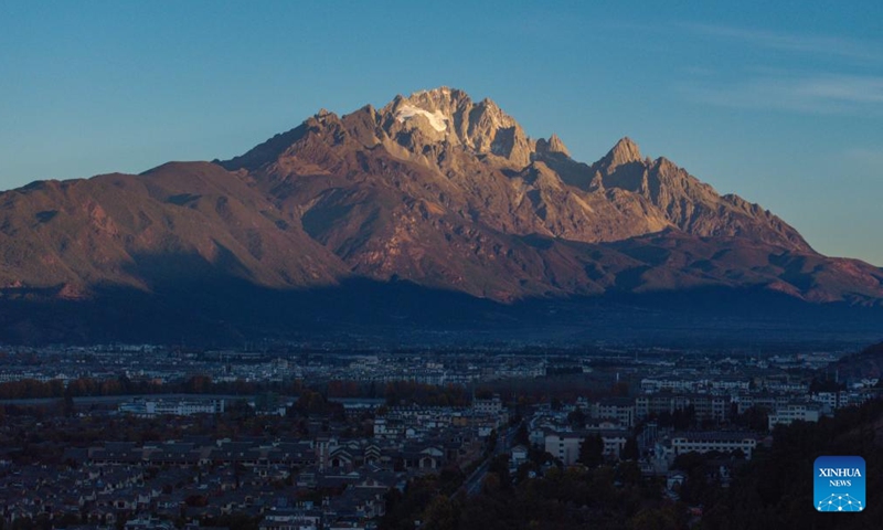 A drone photo shows a view of Lijiang City at sunrise in southwest China's Yunnan Province, Dec. 9, 2024. (Photo: Xinhua)