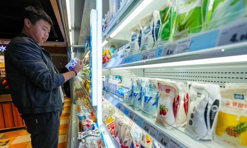 A customer selects goods at a supermarket in Guiyang City, southwest China's Guizhou Province, Dec. 9, 2024. China's consumer price index (CPI), a main gauge of inflation, was up 0.2 percent year on year in November, the National Bureau of Statistics said Monday. (Photo: Xinhua)