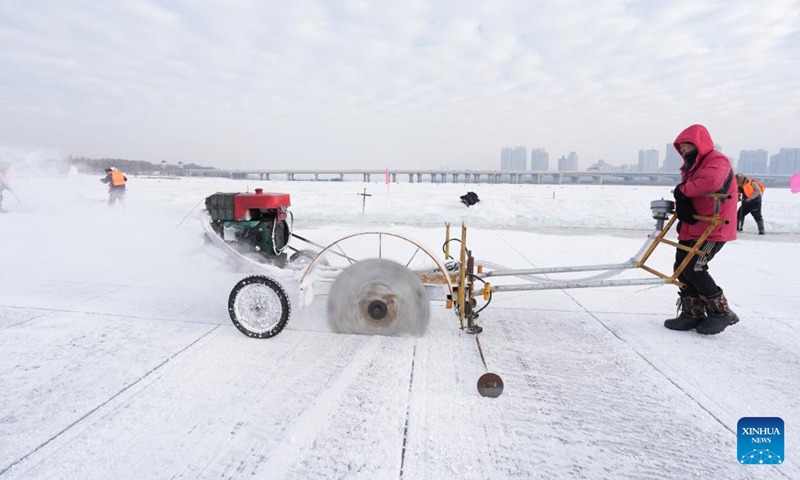 Workers collect ice from the Songhua River in Harbin, capital of northeast China's Heilongjiang Province, Dec. 9, 2024. (Photo: Xinhua)