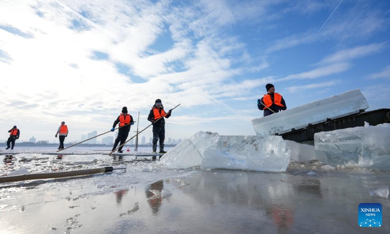 Workers collect ice from the Songhua River in Harbin, capital of northeast China's Heilongjiang Province, Dec. 9, 2024. (Photo: Xinhua)
