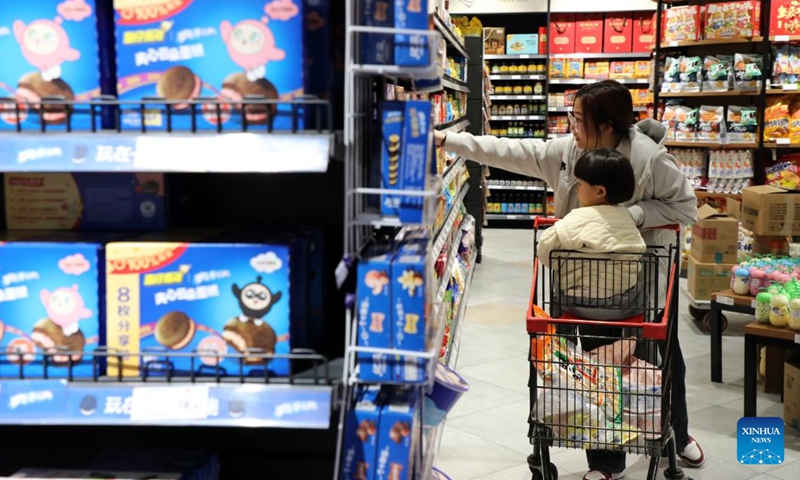 Customers select food at a supermarket in Boxing County, east China's Shandong Province, Dec. 9, 2024. China's consumer price index (CPI), a main gauge of inflation, was up 0.2 percent year on year in November, the National Bureau of Statistics said Monday. (Photo: Xinhua)