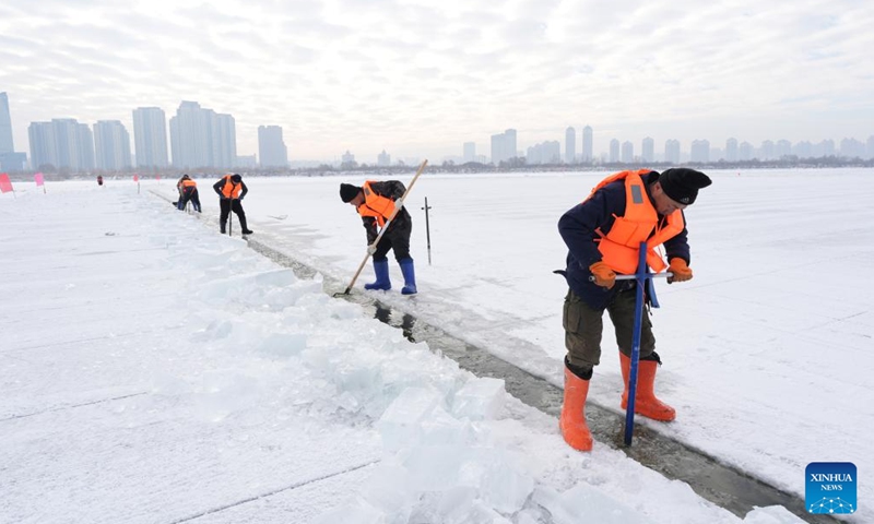Workers collect ice from the Songhua River in Harbin, capital of northeast China's Heilongjiang Province, Dec. 9, 2024. (Photo: Xinhua)