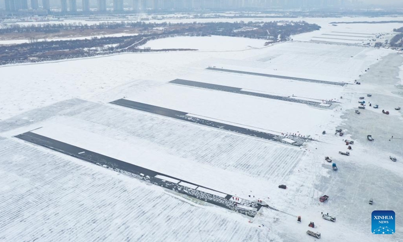 An aerial drone photo taken on Dec. 9, 2024 shows workers collecting ice from the Songhua River in Harbin, capital of northeast China's Heilongjiang Province. (Photo: Xinhua)