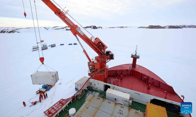 Members of China's 41st Antarctic expedition team unload supplies from China's research icebreaker Xuelong 2 in Antarctica, Dec. 9, 2024. (Photo: Xinhua)