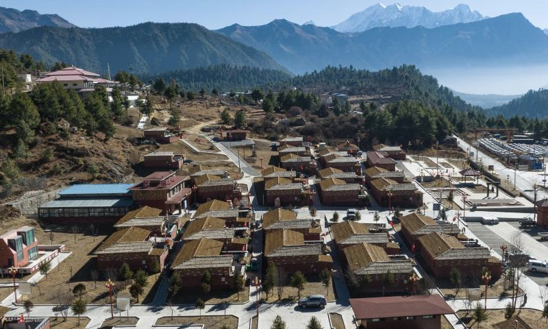 A drone photo taken on Dec. 15, 2024 shows the new Daman Village in Jilung Town of Xigaze in southwest China's Xizang Autonomous Region. The new Daman Village, about 30-kilometer away from the China-Nepal border, is the only habitat of Daman people in China. The living condition in the village has been improved substantially in recent years. A series of homestay facilities under construction there are expected to boost the local annual per capita income to 2,000 yuan (about 275 U.S. dollars) when operational. (Xinhua/Tenzin Nyida)