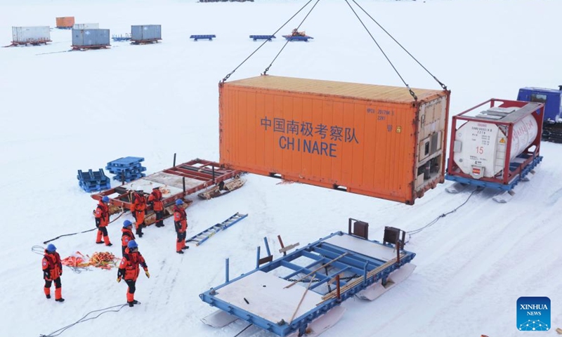 Members of China's 41st Antarctic expedition team unload supplies in Antarctica, Dec. 9, 2024. Currently on China's 41st Antarctic expedition, research icebreakers Xuelong and Xuelong 2, or Snow Dragon and Snow Dragon 2, carried out unloading operations surrounding Zhongshan Station, a Chinese research base in Antarctica. (Photo: Xinhua)