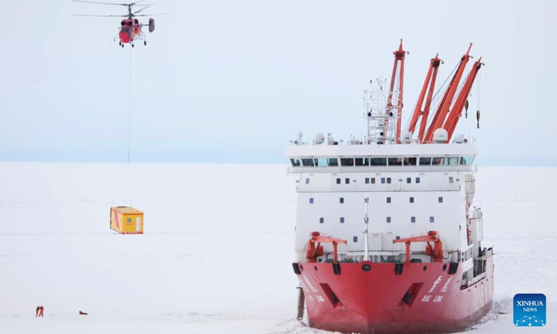 A helicopter transports supplies from China's research icebreaker Xuelong in Antarctica, Dec. 7, 2024. Currently on China's 41st Antarctic expedition, research icebreakers Xuelong and Xuelong 2, or Snow Dragon and Snow Dragon 2, carried out unloading operations surrounding Zhongshan Station, a Chinese research base in Antarctica. (Photo: Xinhua)