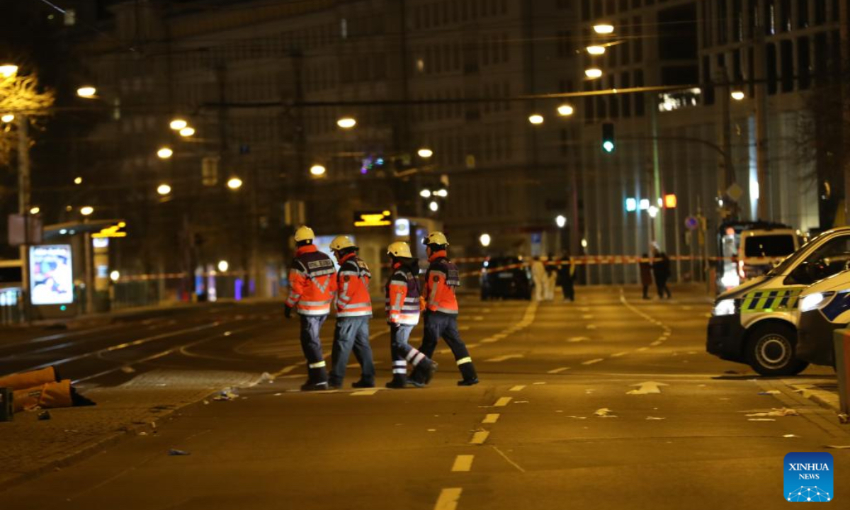 This photo shows rescuers near a Christmas market where a car rammed into a crowd in Magdeburg, Germany, Dec. 21, 2024. A car plowed through a Christmas market in the central German city of Magdeburg on Friday evening, killing at least two people - an adult and a small child - and injuring over 60, Saxony-Anhalt's state premier announced. (Photo:Xinhua)