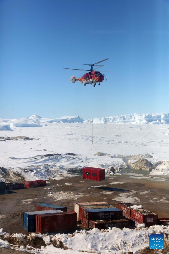 A helicopter unloads supplies at the China's Zhongshan station in Antarctica, Dec. 2, 2024. Currently on China's 41st Antarctic expedition, research icebreakers Xuelong and Xuelong 2, or Snow Dragon and Snow Dragon 2, carried out unloading operations surrounding Zhongshan Station, a Chinese research base in Antarctica. (Photo: Xinhua)