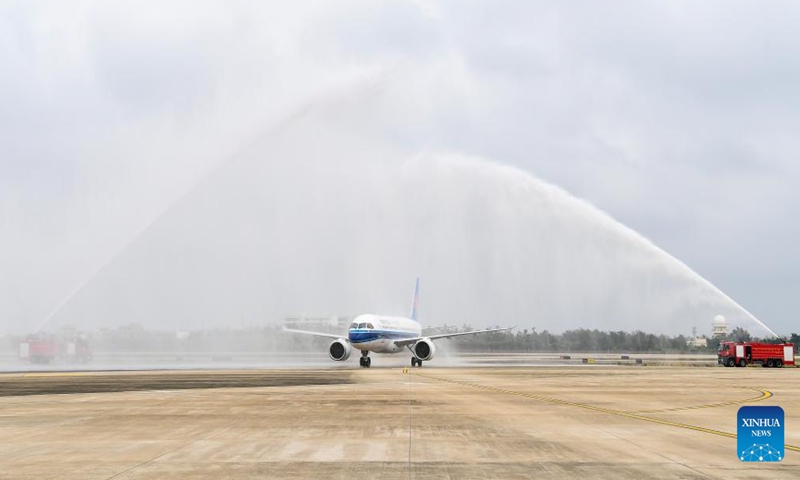 A C919 aircraft operated by China Southern Airlines taxis through the water salute after landing at Haikou Meilan International Airport in Haikou, south China's Hainan Province, on Dec. 11, 2024.  (Photo: Xinhua)