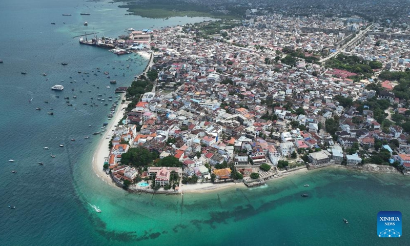 An aerial drone photo taken on Dec. 11, 2024 shows a view of the Stone Town in Zanzibar, Tanzania. Stone Town, designated as a World Heritage Site by the United Nations Educational, Scientific and Cultural Organization in 2000, is a prime example of the Swahili coastal trading towns of East Africa. It retains its urban fabric and townscape largely intact, with many fine buildings reflecting a unique culture that blends African, Arabian, Indian, and European influences accumulated over more than a millennium. (Xinhua/Han Xu)